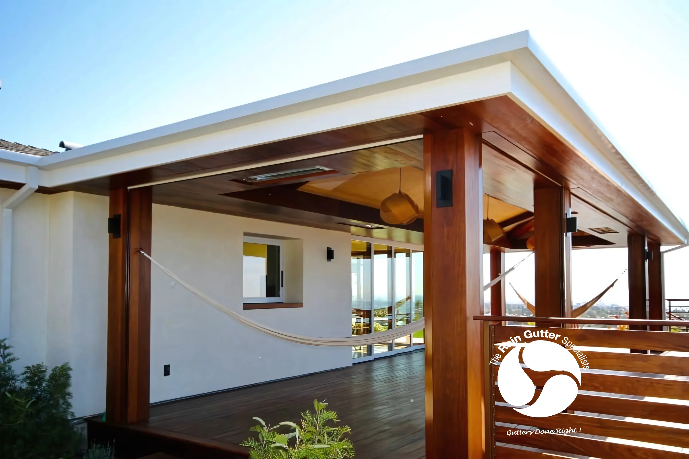 White aluminum rain gutters installed on a home