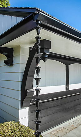 Black flat face gutters with decorative rain chain